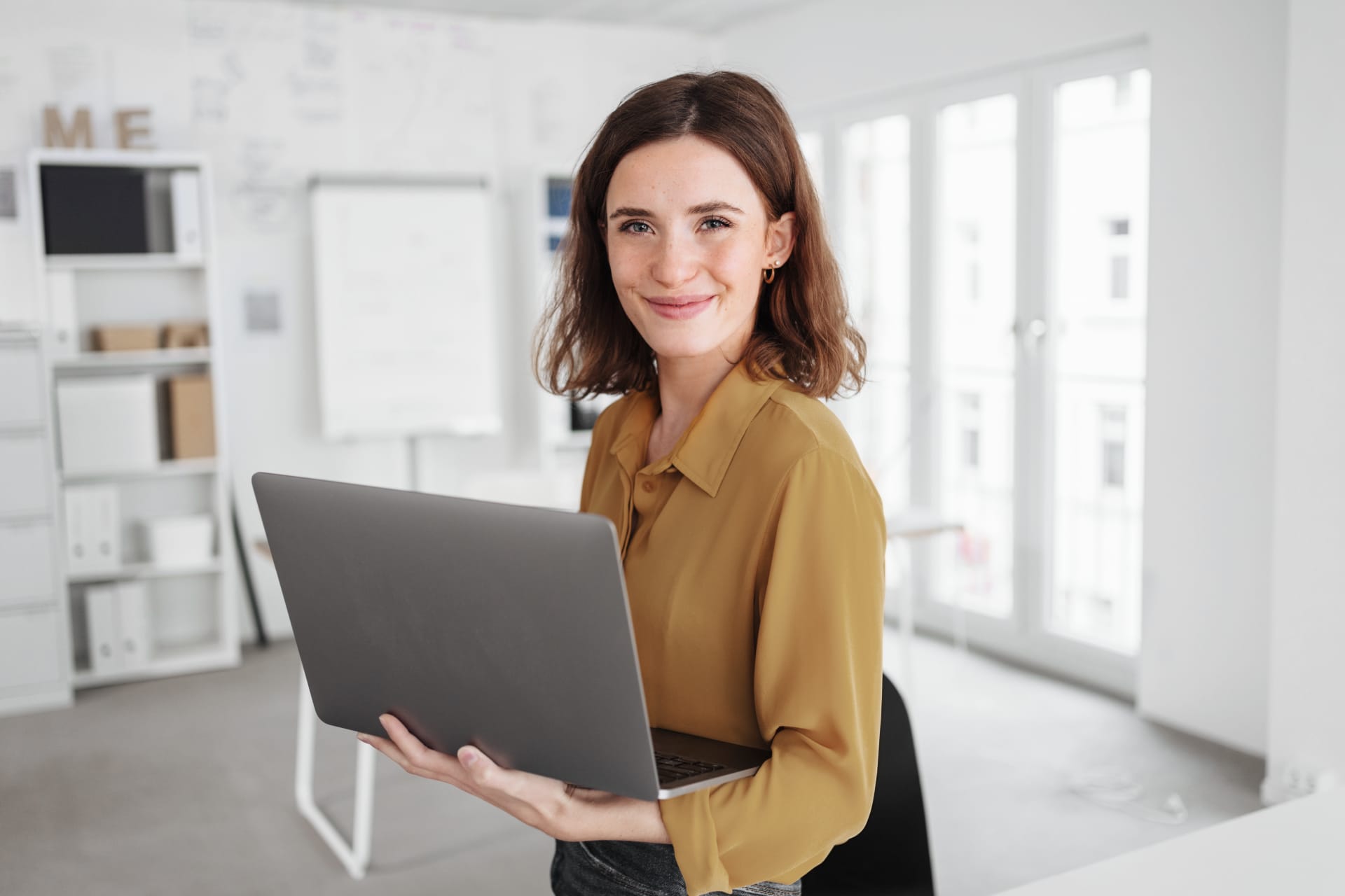  Confident Businesswoman with Laptop