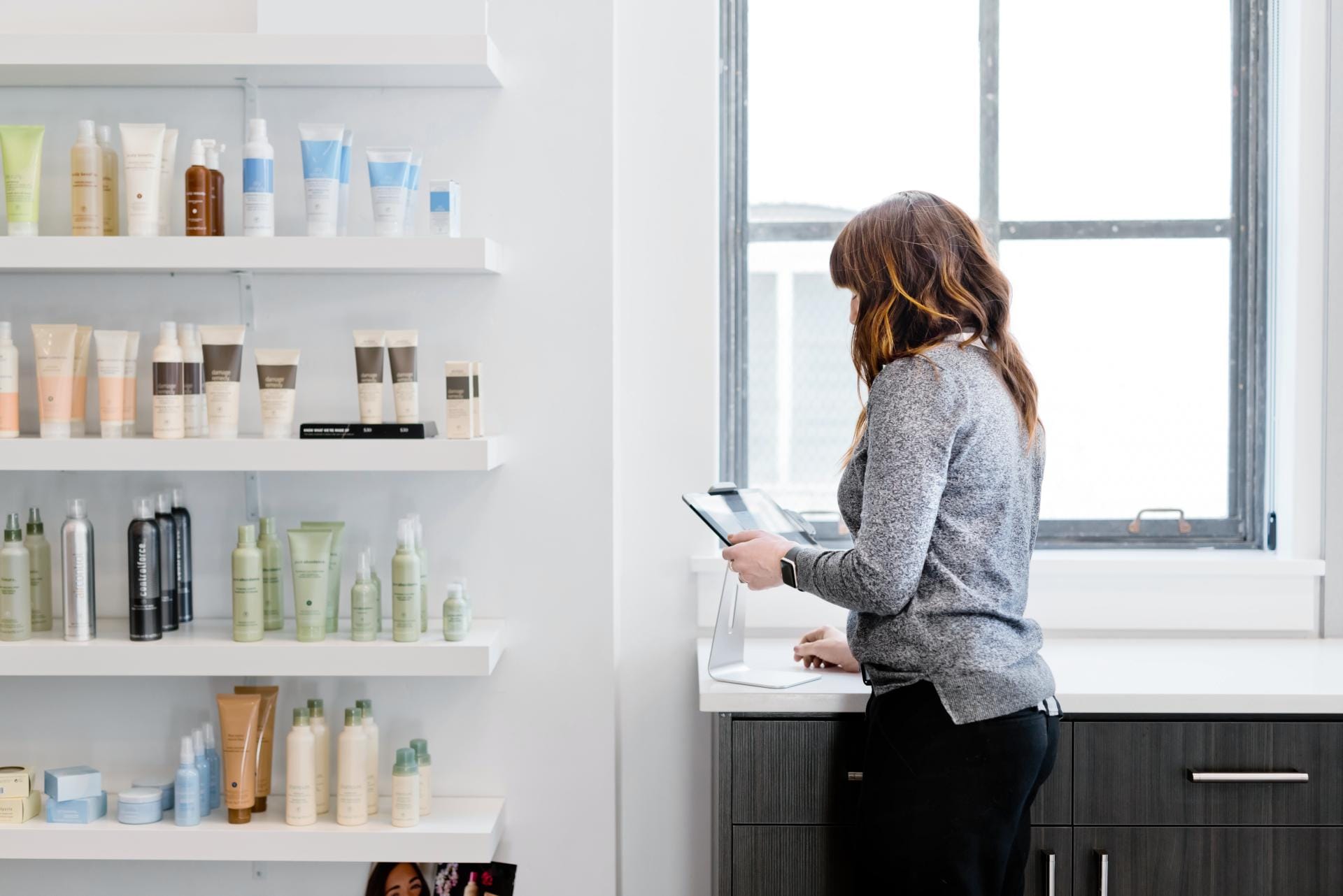 Woman in Salon Doing Inventory