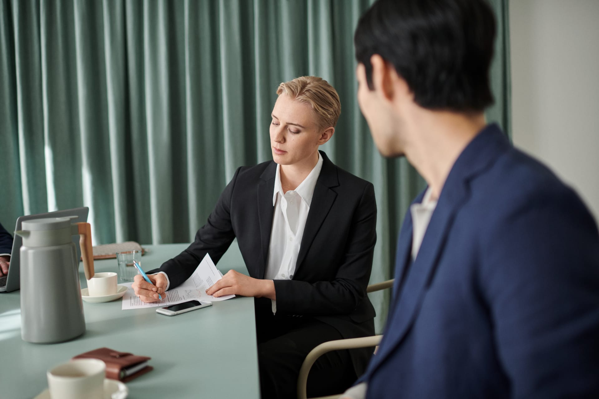 Woman signing a contract